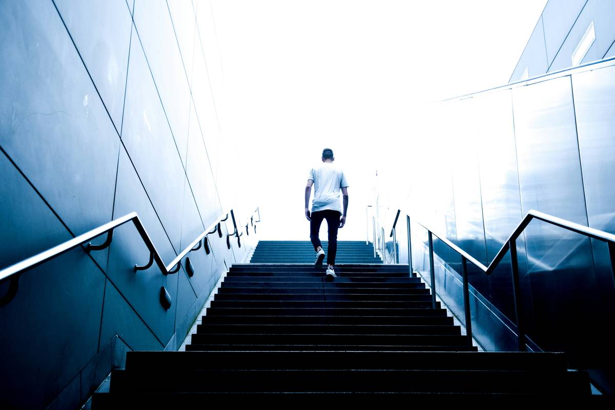 Man overcoming obstacles with resilience plan for sustainable weight loss